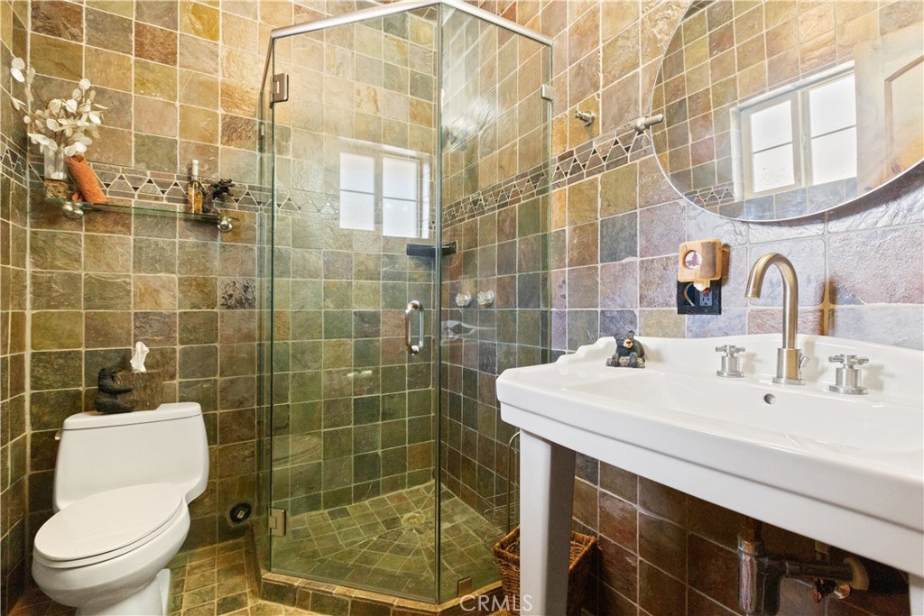 1870 Oak Springs Valley Road Wrightwood, CA 92397 - Photo 13 of 37 a bathroom with a sink a toilet and shower