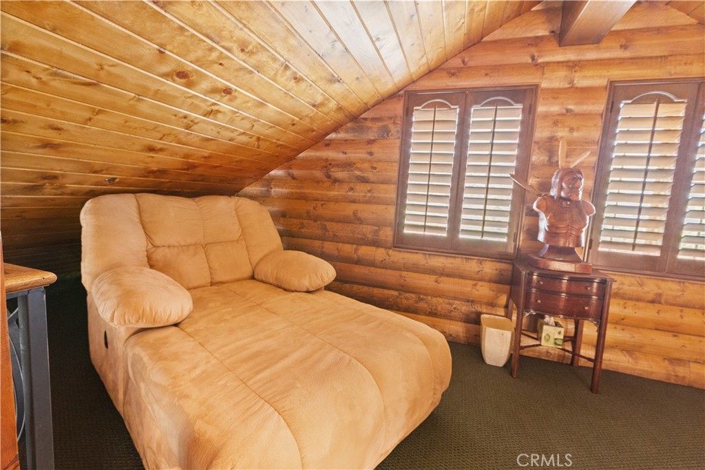 1870 Oak Springs Valley Road Wrightwood, CA 92397 - Photo 20 of 37 a bedroom with a bed and a night stand