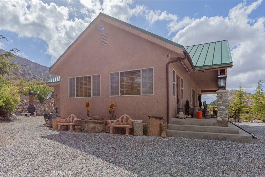 1870 Oak Springs Valley Road Wrightwood, CA 92397 - Photo 29 of 37 a view of a house with a patio