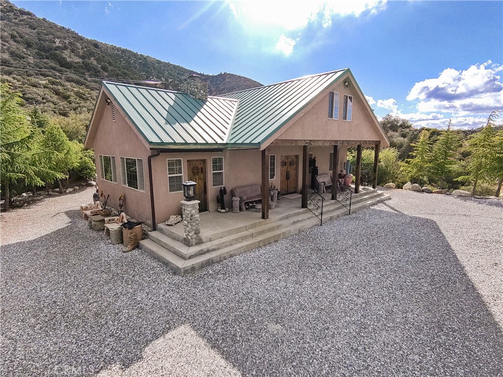 1870 Oak Springs Valley Road Wrightwood, CA 92397 - Photo 3 of 37 a view of a house with a patio
