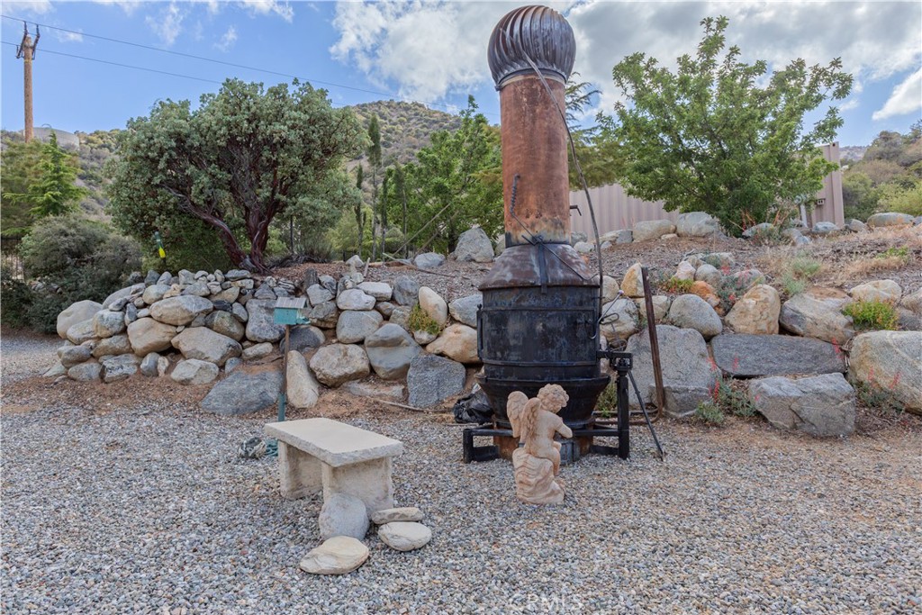1870 Oak Springs Valley Road Wrightwood, CA 92397 - Photo 32 of 37 a view of a backyard with chairs