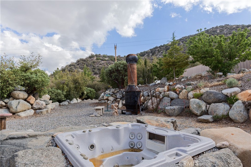 1870 Oak Springs Valley Road Wrightwood, CA 92397 - Photo 34 of 37 a view of a backyard with sitting area