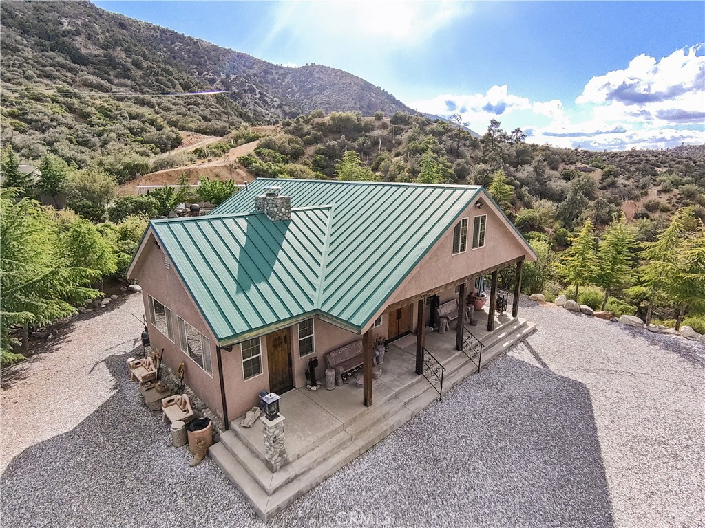 1870 Oak Springs Valley Road Wrightwood, CA 92397 - Photo 4 of 37 an aerial view of a house roof deck and mountain view