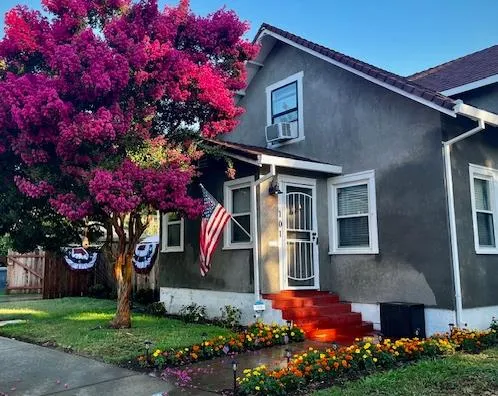 a front view of a house with a yard