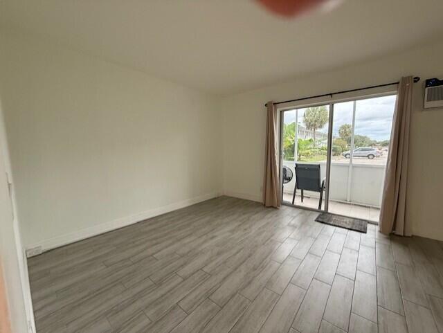 168 Northampton I West Palm Beach, FL 33417 - Photo 13 of 22 a view of an empty room with glass door