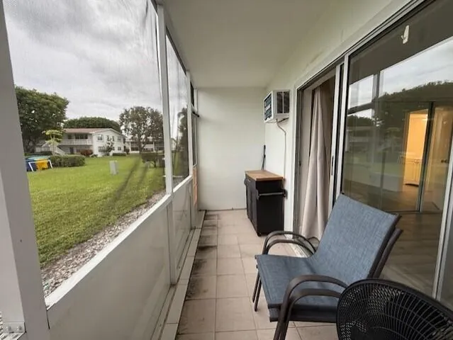 a view of a balcony with furniture