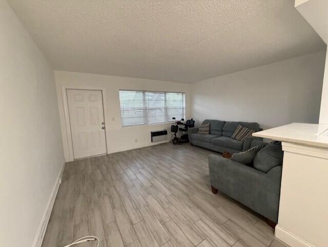 168 Northampton I West Palm Beach, FL 33417 - Photo 7 of 22 a living room with furniture and a wooden floor