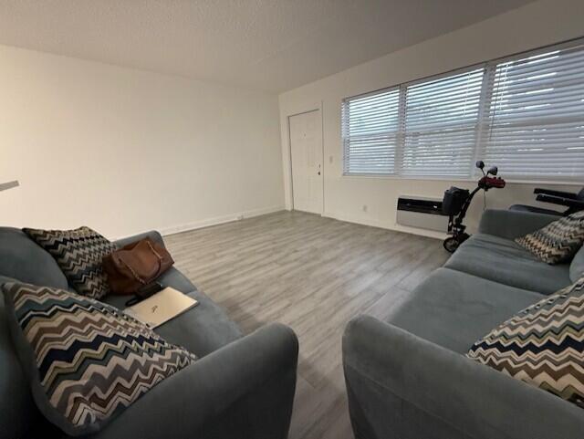 168 Northampton I West Palm Beach, FL 33417 - Photo 8 of 22 a living room with furniture and a window