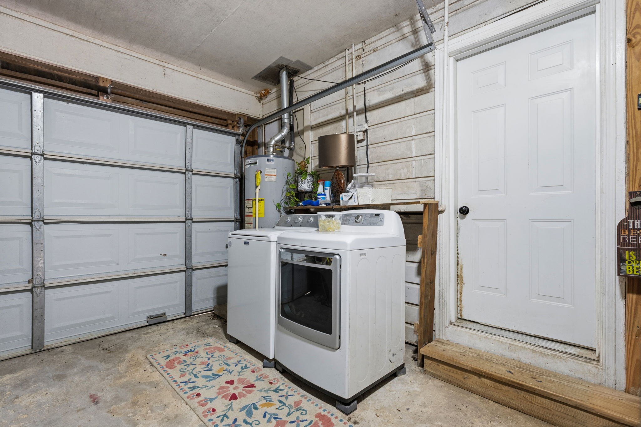 431 Corydon Drive Houston, TX 77336 - Photo 23 of 26 Functional garage space with washer and dryer connections, providing convenience for everyday tasks along with additional storage and workspace potential.