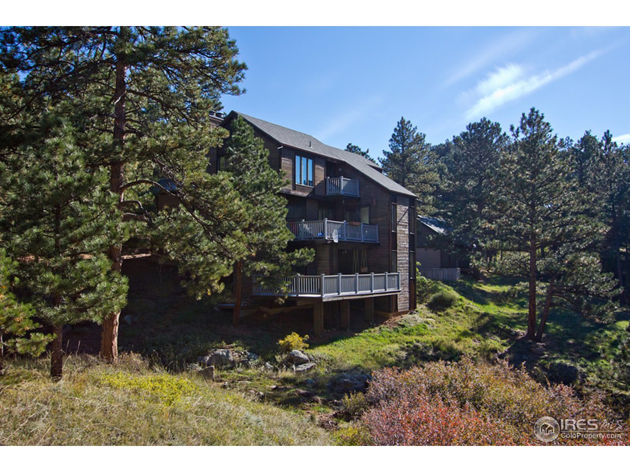 398 Broken Fence Road Boulder, CO 80302 - Photo 1 of 25 a view of a house with a yard