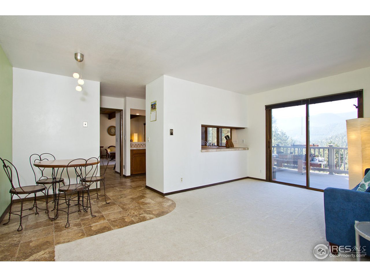 398 Broken Fence Road Boulder, CO 80302 - Photo 16 of 25 a view of a livingroom with furniture window and wooden floor