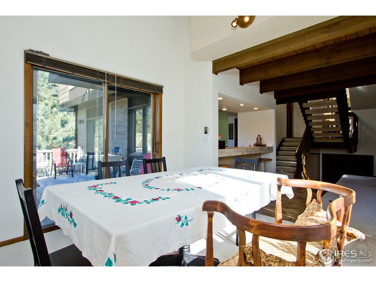 398 Broken Fence Road Boulder, CO 80302 - Photo 17 of 25 a dining room with a table and chairs