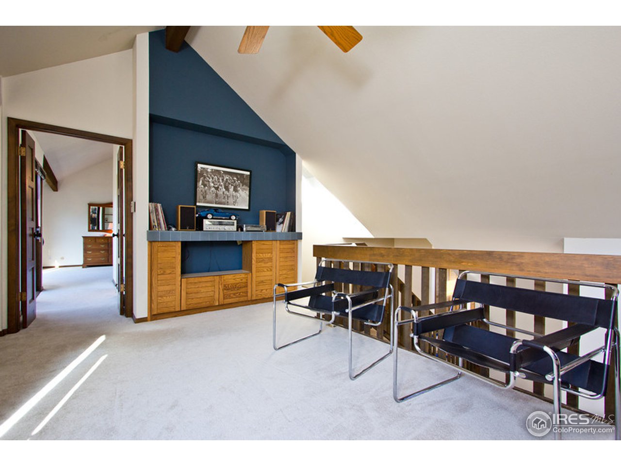 398 Broken Fence Road Boulder, CO 80302 - Photo 18 of 25 a living room with furniture and a flat screen tv