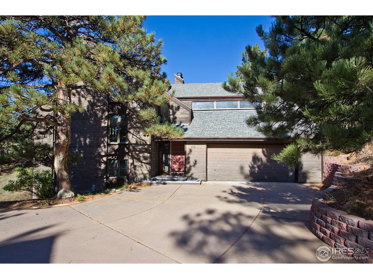 398 Broken Fence Road Boulder, CO 80302 - Photo 24 of 25 a view of a house with a yard