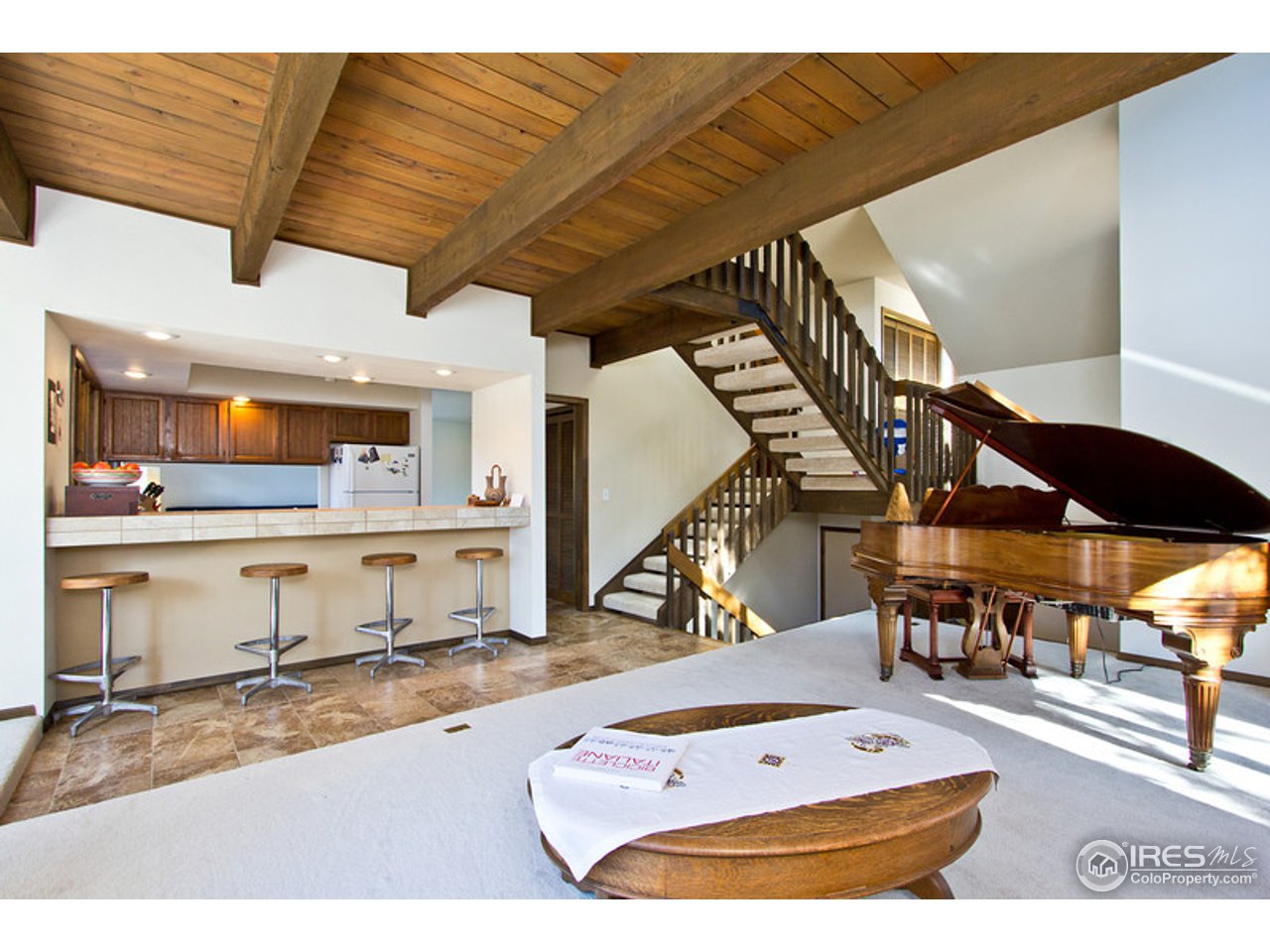 398 Broken Fence Road Boulder, CO 80302 - Photo 3 of 25 a picture of a living room and kitchen