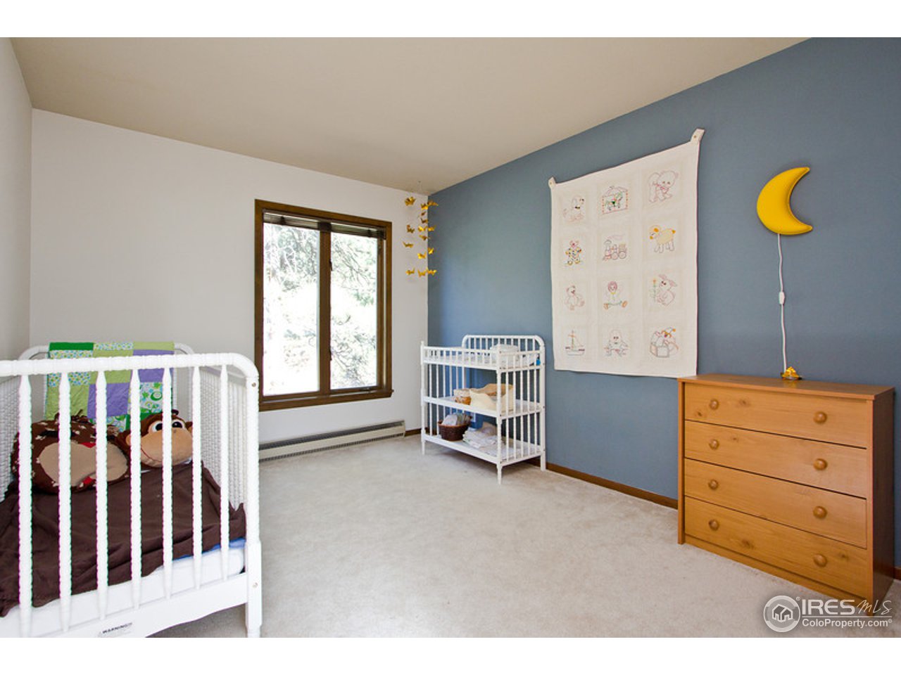 398 Broken Fence Road Boulder, CO 80302 - Photo 8 of 25 a bedroom with a bed and a window