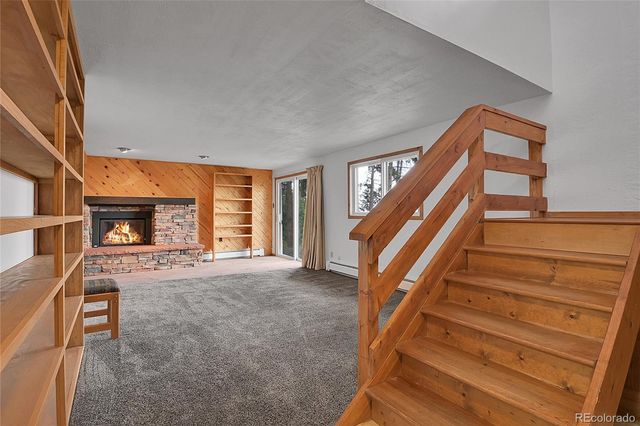 a view of livingroom with stairs and furniture