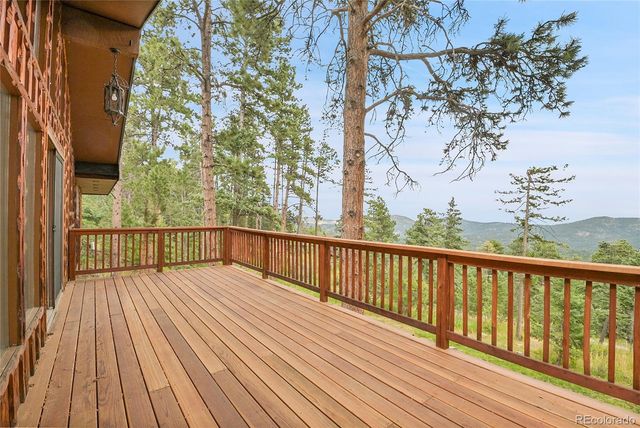 a view of balcony with wooden floor
