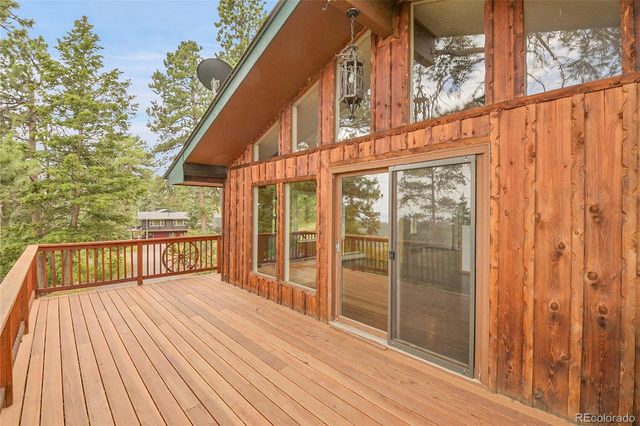 a view of balcony with wooden floor