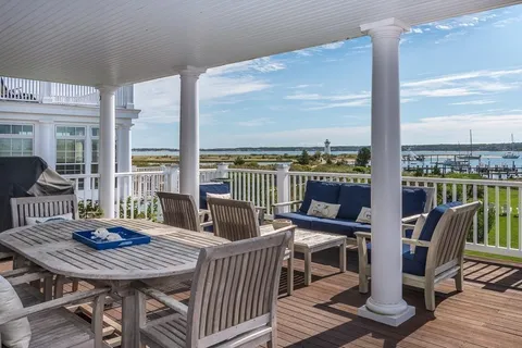 a view of a city from a dining room with furniture