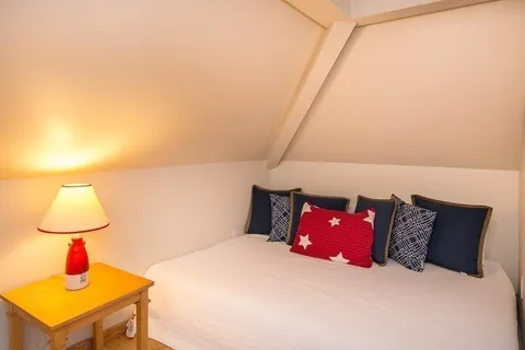 a bed room with two bed and a couch