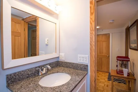 an aerial view of a houses with a swimming pool