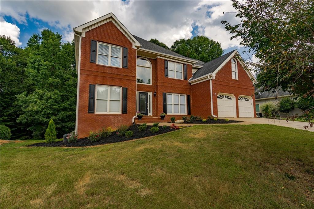 7084 Hunters Ridge Woodstock, GA 30189 - Photo 1 of 1 Brick front with gorgeous curb appeal