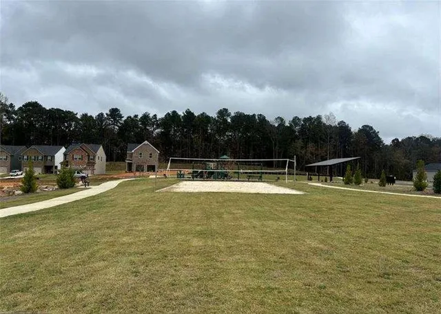 a view of a swimming pool with a yard