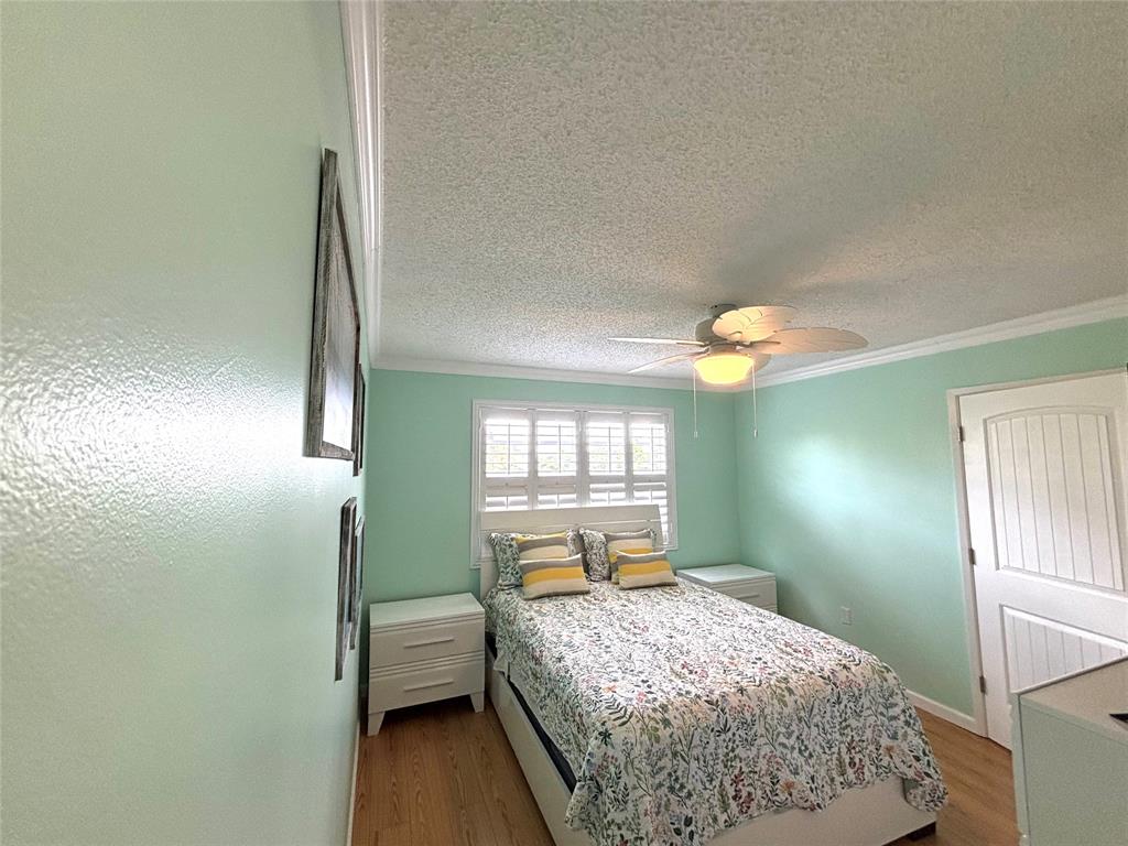 2236 North Cypress Bend Drive, Unit 304 Pompano Beach, FL 33069 - Photo 3 of 17 a bedroom with a bed and window