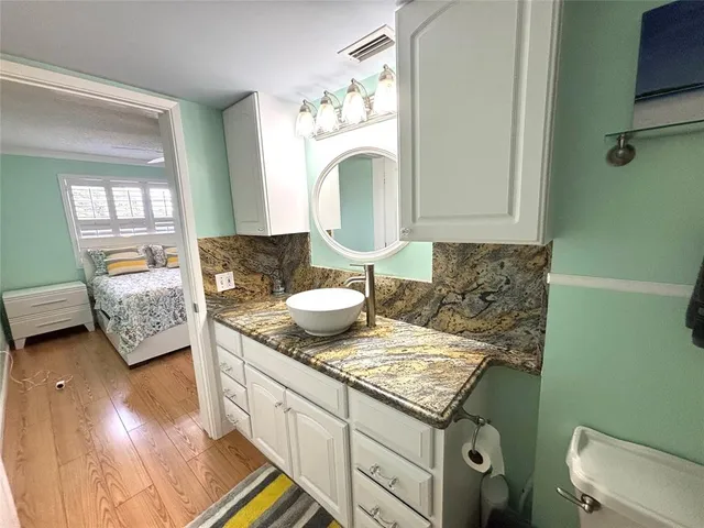 a living room with granite countertop furniture and a fireplace