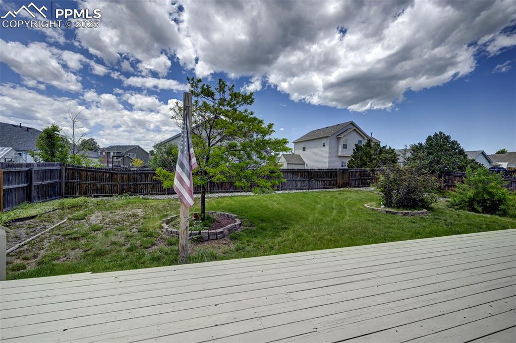 12593 Pine Valley Circle Peyton, CO 80831 - Photo 13 of 17 Deck featuring a fenced backyard and a residential view