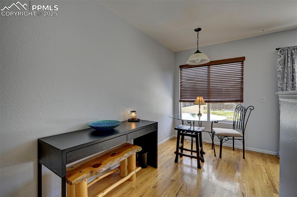 12593 Pine Valley Circle Peyton, CO 80831 - Photo 4 of 17 Dining room featuring light wood-style flooring and baseboards