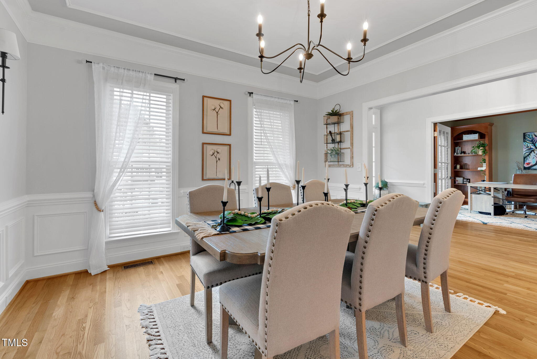 1113 Colonial Club Road Wake Forest, NC 27587 - Photo 10 of 41 a view of a dining room with furniture and wooden floor