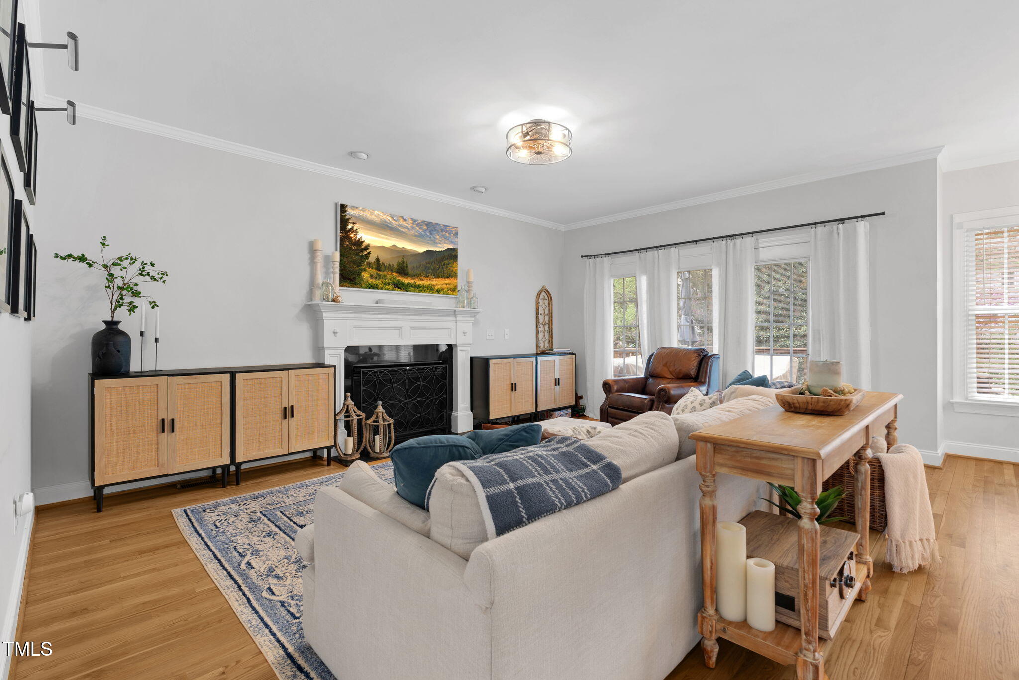 1113 Colonial Club Road Wake Forest, NC 27587 - Photo 12 of 41 a living room with furniture and a fireplace