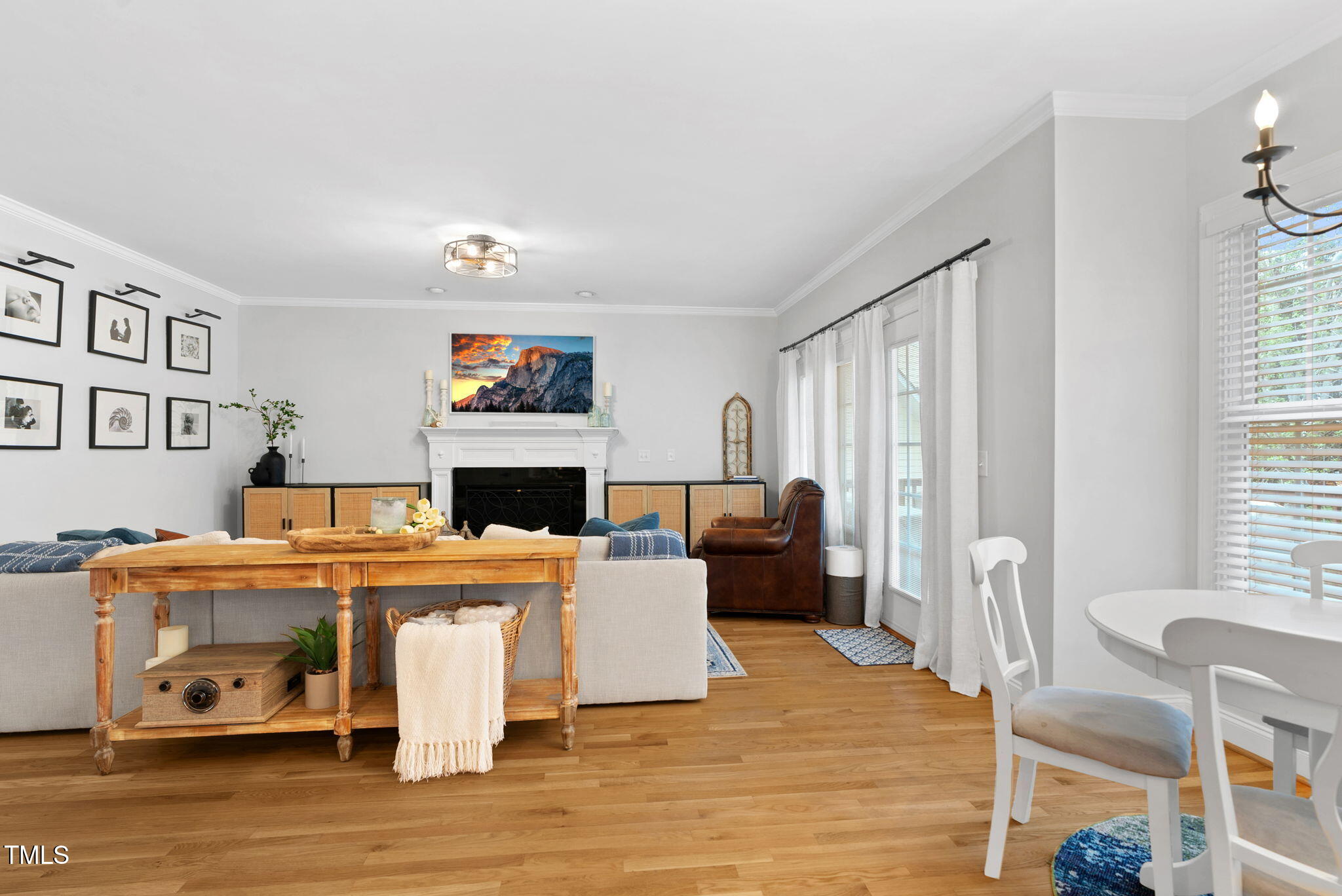 1113 Colonial Club Road Wake Forest, NC 27587 - Photo 14 of 41 a living room with furniture a fireplace and a large window