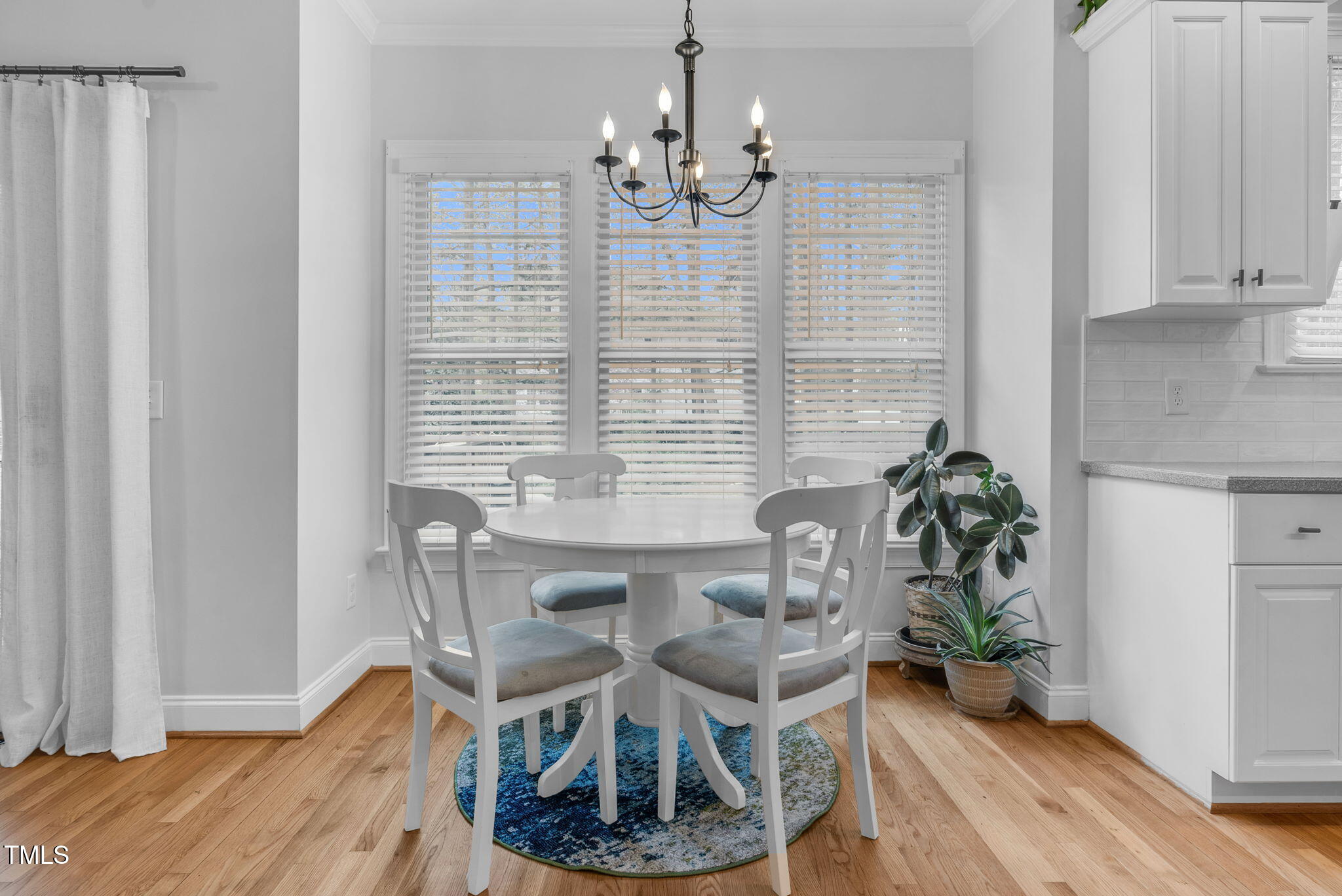1113 Colonial Club Road Wake Forest, NC 27587 - Photo 15 of 41 a view of a dining room with furniture and wooden floor