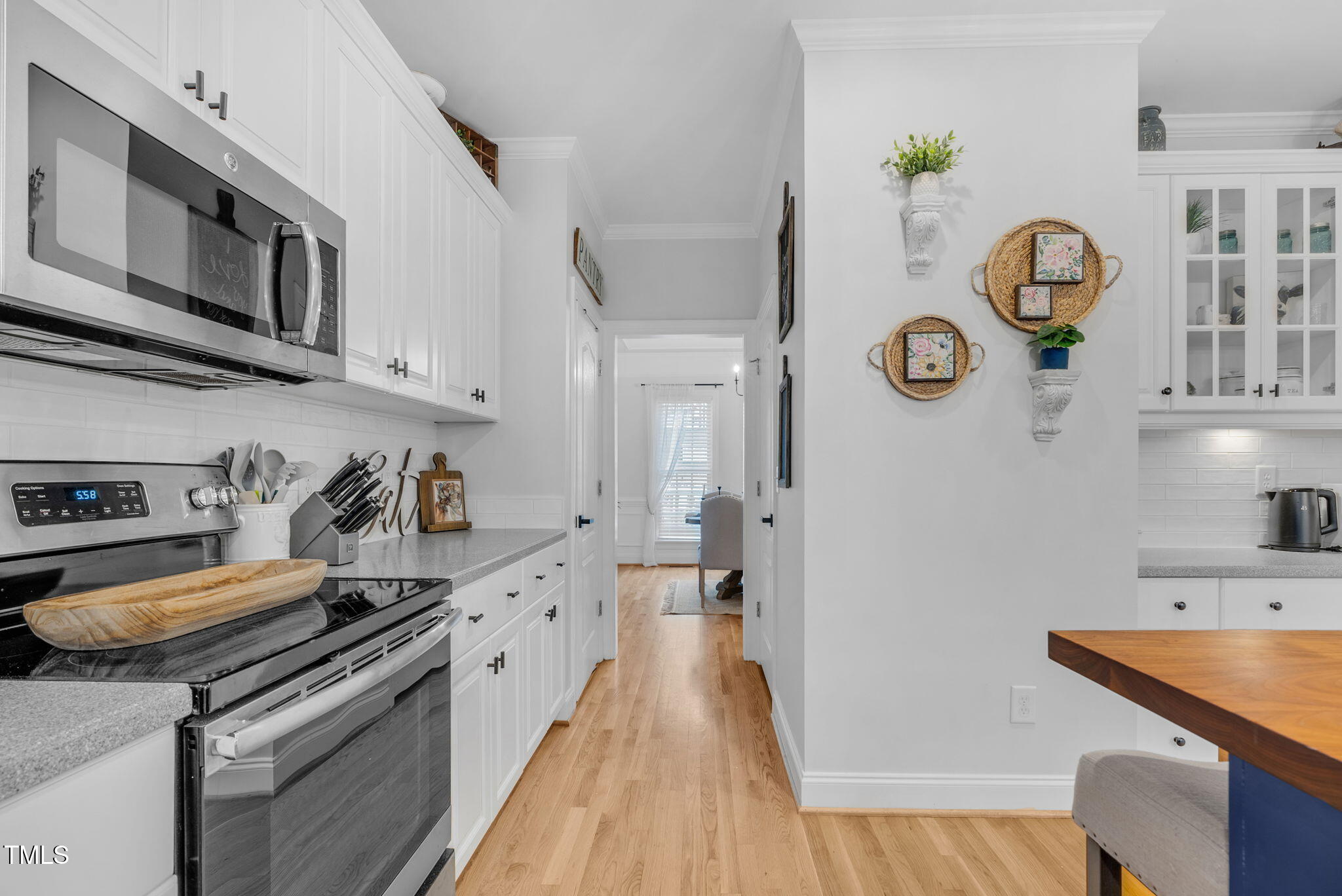 1113 Colonial Club Road Wake Forest, NC 27587 - Photo 19 of 41 a kitchen with stainless steel appliances granite countertop a stove and a sink