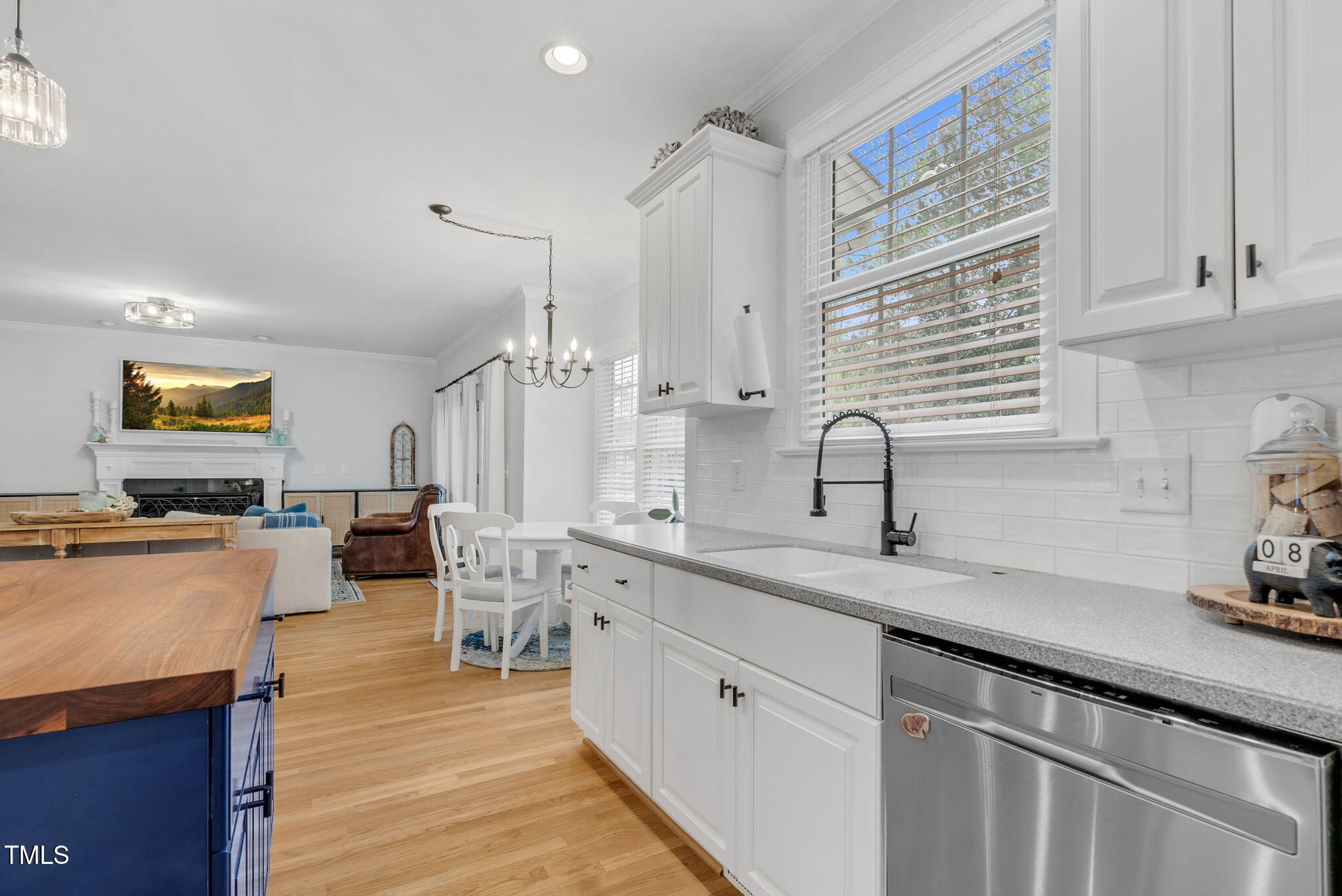1113 Colonial Club Road Wake Forest, NC 27587 - Photo 20 of 41 a kitchen with lots of counter top space and wooden floor