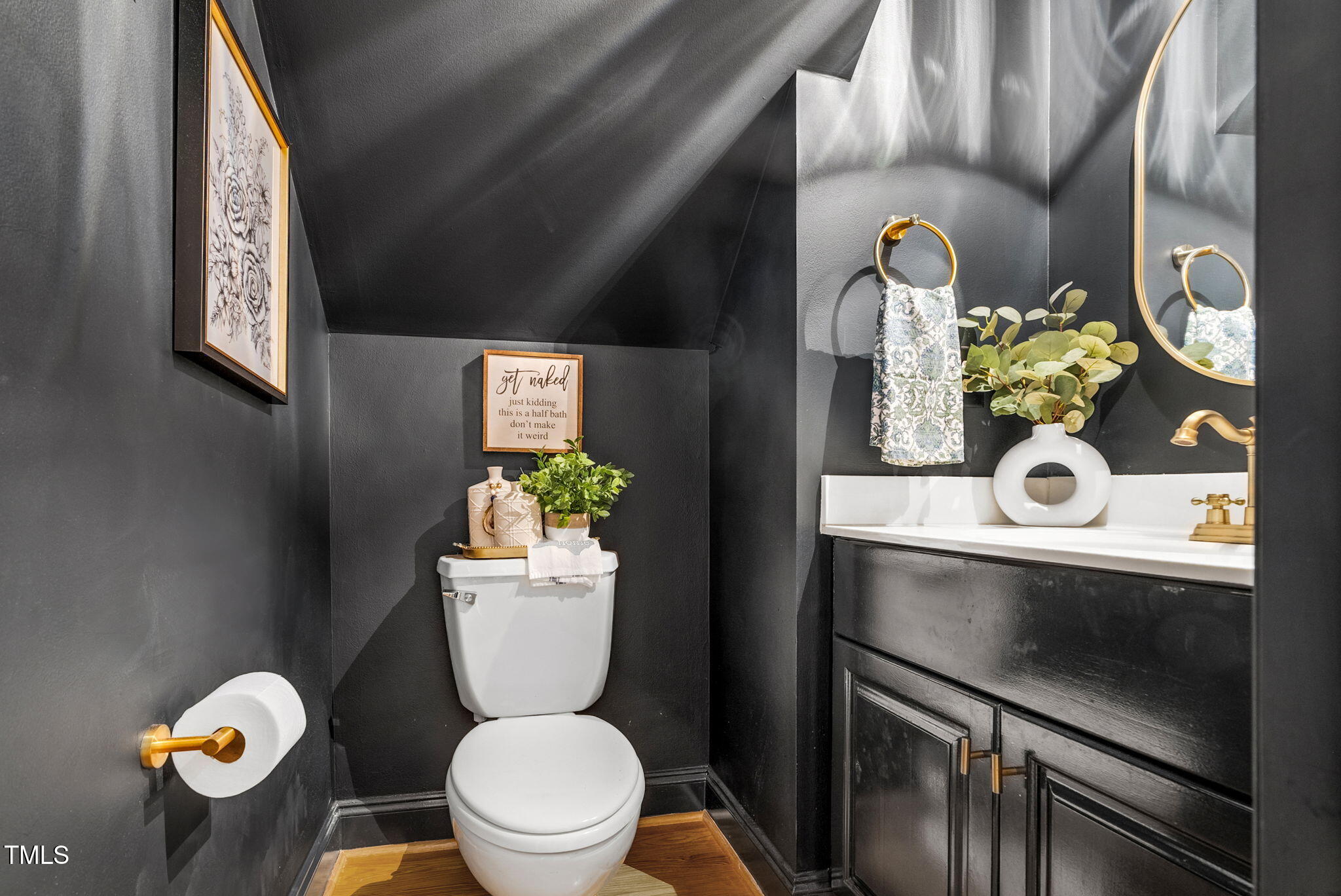 1113 Colonial Club Road Wake Forest, NC 27587 - Photo 22 of 41 a bathroom with a toilet sink and mirror