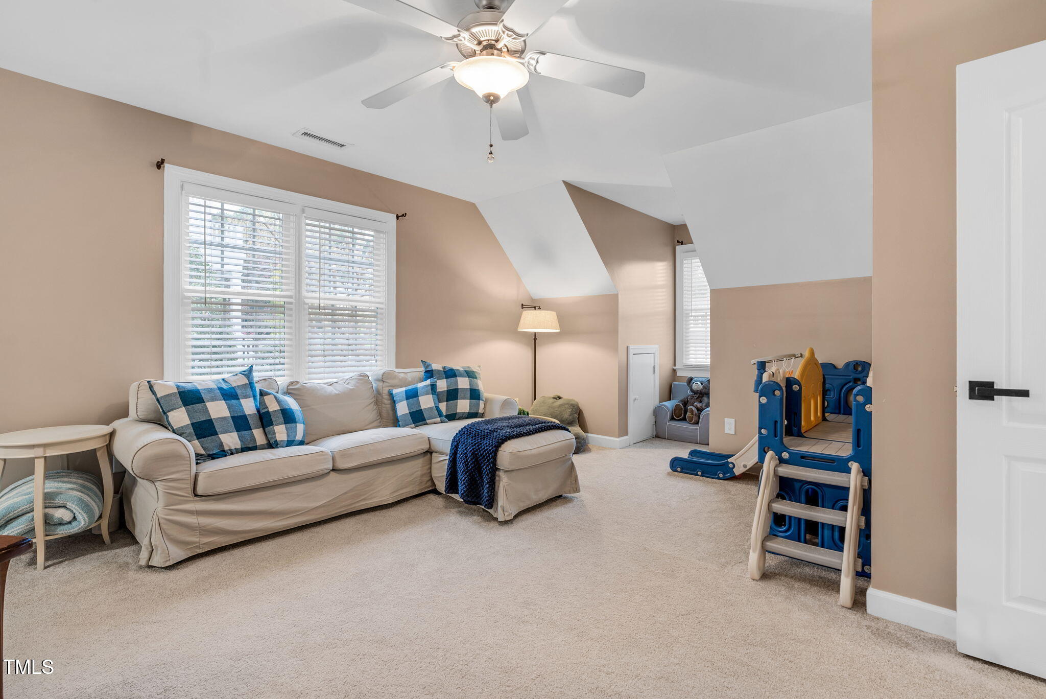 1113 Colonial Club Road Wake Forest, NC 27587 - Photo 23 of 41 a living room with furniture and a chandelier
