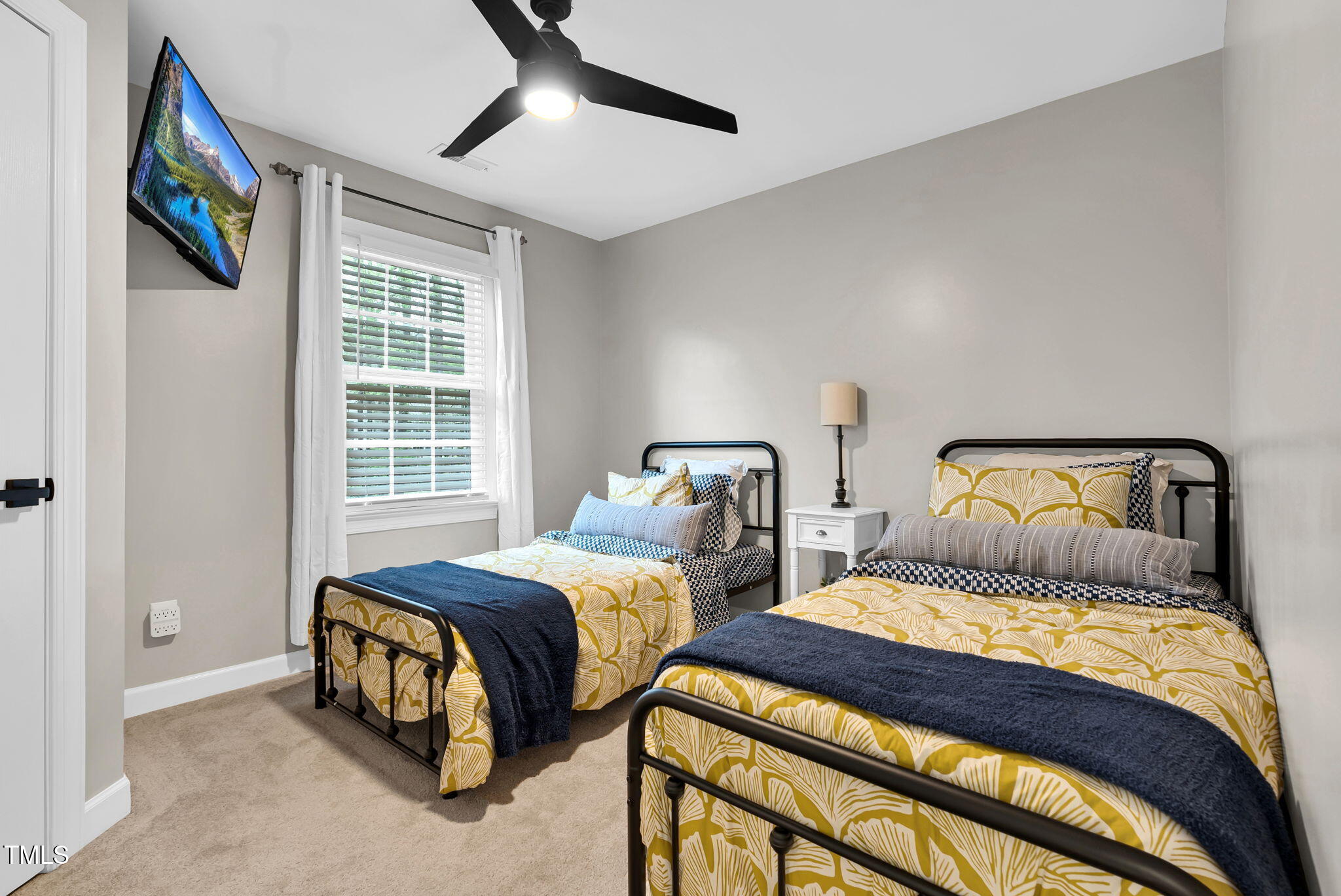 1113 Colonial Club Road Wake Forest, NC 27587 - Photo 29 of 41 a bedroom with two beds and a window
