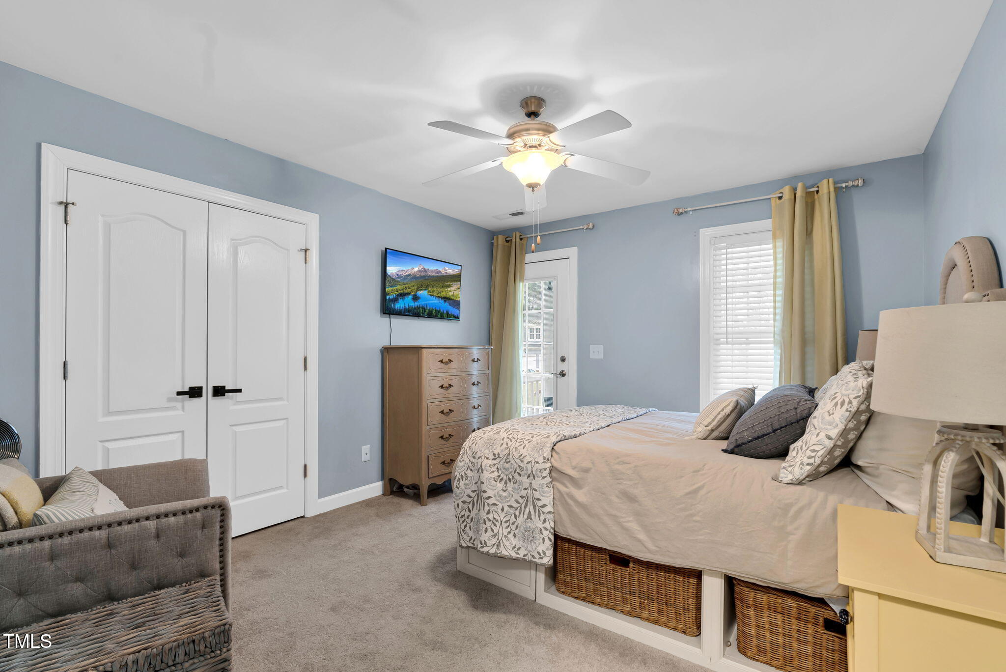 1113 Colonial Club Road Wake Forest, NC 27587 - Photo 31 of 41 a bedroom with a bed and a chandelier