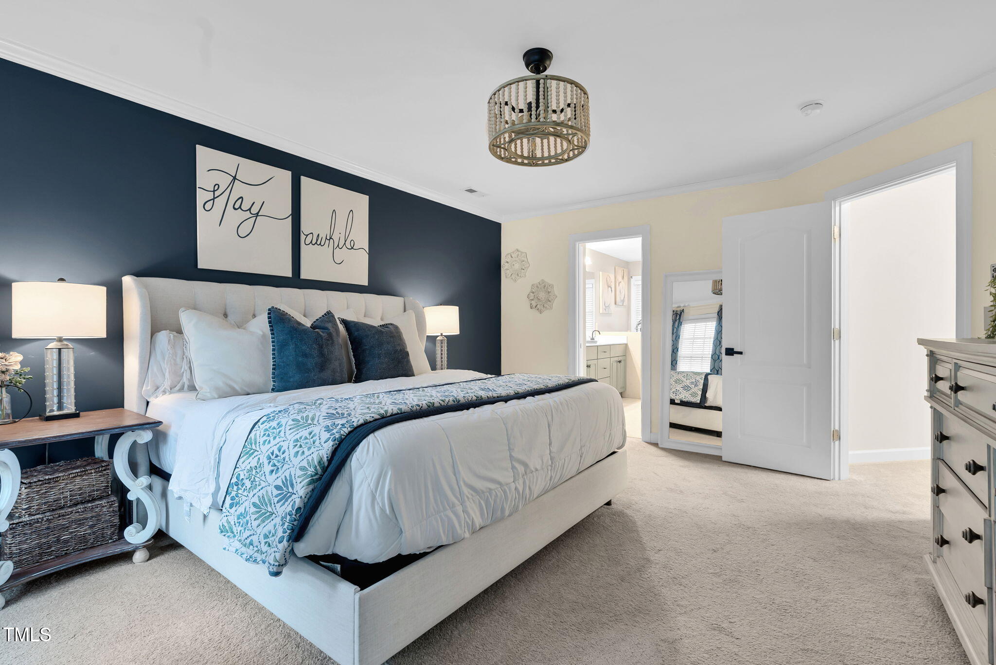 1113 Colonial Club Road Wake Forest, NC 27587 - Photo 33 of 41 a spacious bedroom with a bed and painting on the wall