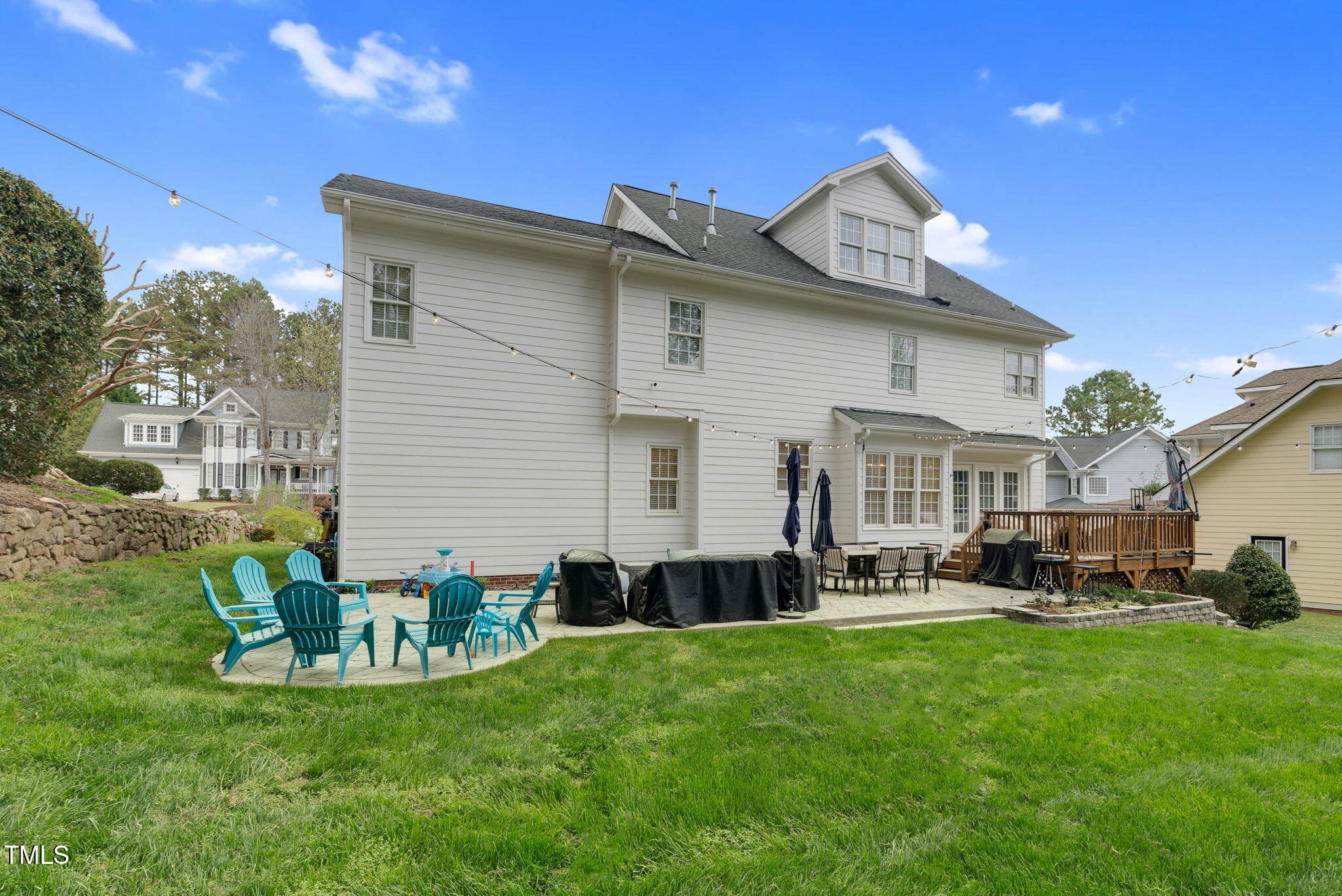 1113 Colonial Club Road Wake Forest, NC 27587 - Photo 38 of 41 a backyard of a house with table and chairs