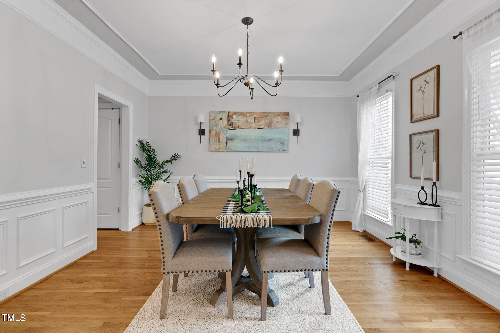 1113 Colonial Club Road Wake Forest, NC 27587 - Photo 9 of 41 a view of a dining room with furniture and wooden floor