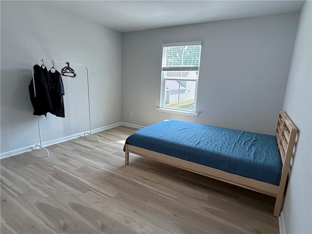 1543 Maston Road Auburn, GA 30011 - Photo 17 of 33 a bedroom with a bed and dresser