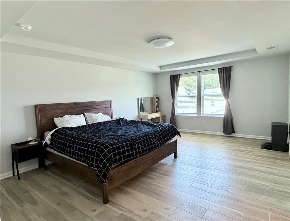 1543 Maston Road Auburn, GA 30011 - Photo 21 of 33 a bedroom with a bed and window