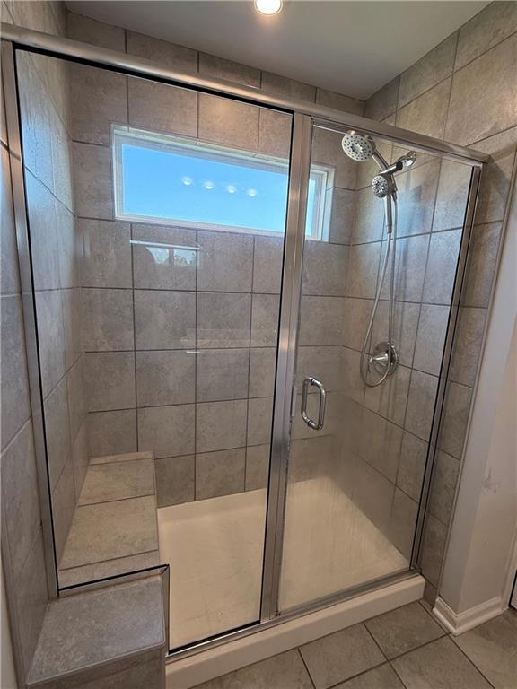 1543 Maston Road Auburn, GA 30011 - Photo 22 of 33 a bathroom with a glass shower door