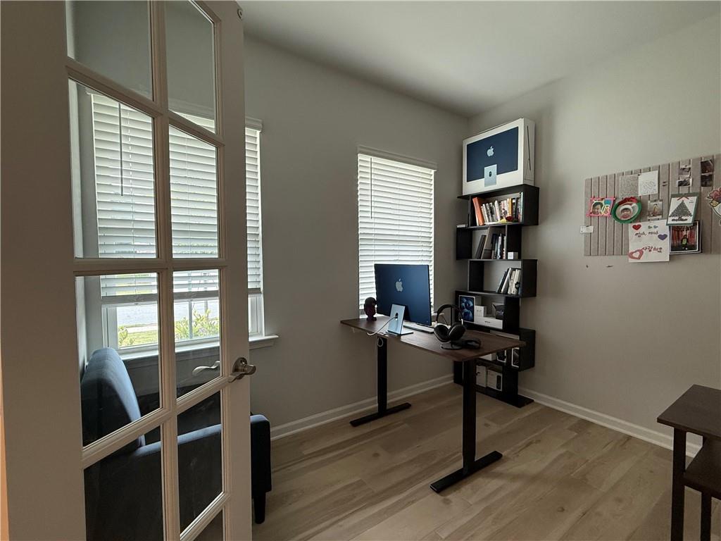 1543 Maston Road Auburn, GA 30011 - Photo 4 of 33 a view of a workspace with furniture and a window
