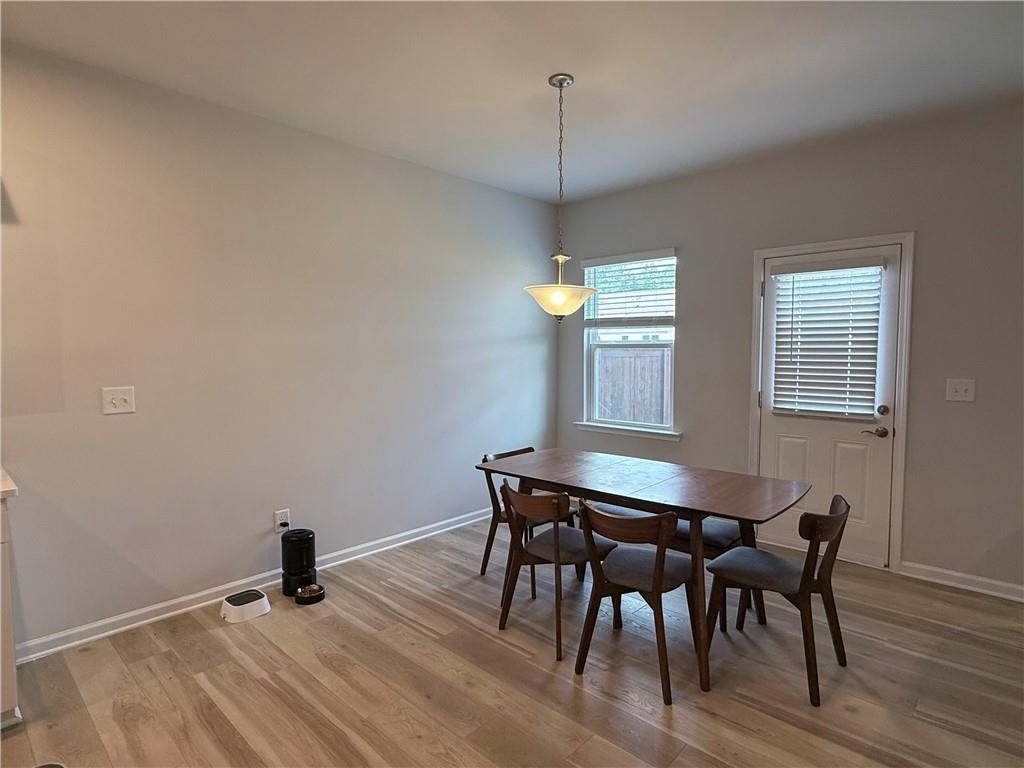 1543 Maston Road Auburn, GA 30011 - Photo 9 of 33 a view of a dining room with furniture and wooden floor